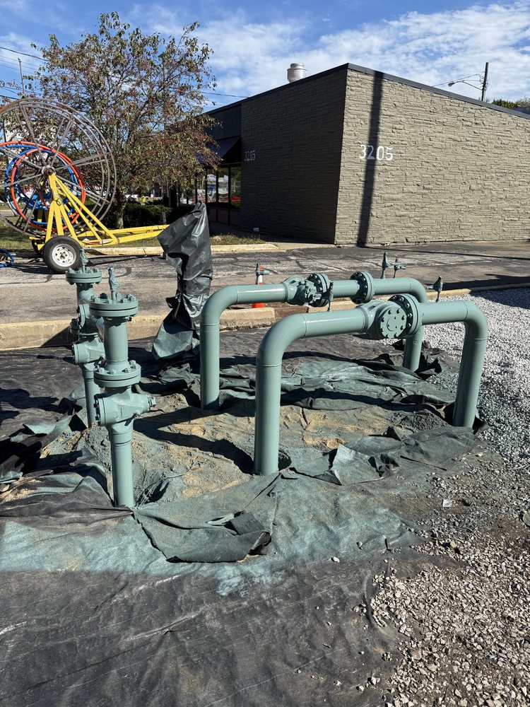 Freshly coated field pipeline and valves in a protected work area